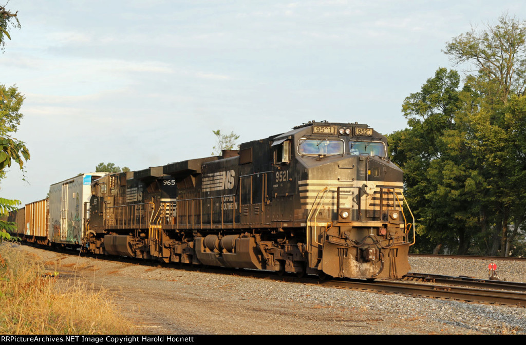 NS 9521 leads train P80-07 thru the yard